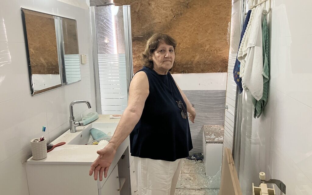 Shula Giladi stands in the bathroom of her house in Shtula, damaged during the Israel-Hezbollah war on May 23, 2025. (Diana Bletter/Times of Israel) Shula Giladi stands in the bathroom of her house in Shtula, damaged during the Israel-Hezbollah war on May 23, 2025. (Diana Bletter/Times of Israel)