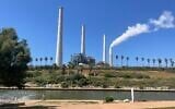 The coal-fired Orot Rabin power station in Hadera, central Israel, seen from the Hadera Stream National Park, April 25, 2025. (Sue Surkes/Times  of Israel)