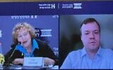 Maxim Rybnikov (right), London-based director at S&P Global Ratings, speaks via video conference at the Israel Democracy Institute’s Eli Hurvitz conference on Economy and Society in Jerusalem, May 27, 2025. At left is former Bank of Israel director Karnit Flug. (Sharon Wrobel/Times of Israel)