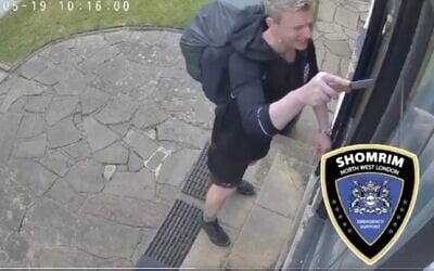 Screen capture of video showing a man using a knife to prise loose a mezuzah from a Jewish home in London, May 19, 2025. (X: Used in accordance with Clause 27a of the Copyright Law)