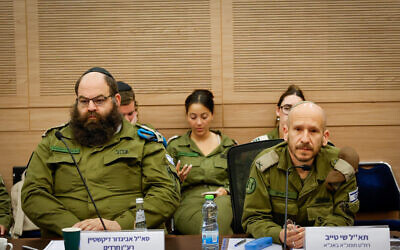 Lt. Col. Avigdor Dickstein (left), who is in charge of encouraging ultra-Orthodox enlistment, and Brig. Gen. Shay Tayeb (right), head of the IDF Personnel Directorate’s Planning and Personnel Management Division, at the Knesset Foreign Affairs and Defense Committee’s Subcommittee for IDF Human Resources, May 21, 2025. (Noam Moskowitz, Office of the Knesset Spokesperson)