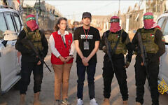 Freed hostage Edan Alexander with a representative of the Red Cross, flanked by Hamas gunmen in the Gaza Strip on May 12, 2025. (via Al Jazeera)