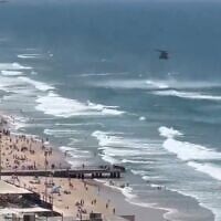 Rescue efforts in Bat Yam after a light plane crashed off the beach, May 16, 2025 (Video screenshot)
