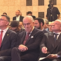 Foreign Minister Gideon Sa'ar (left) attends a meeting of the World Jewish Conference, seated alongside WJC President Ron Lauder (center) in Jerusalem, May 20, 2025. (Tal Schneider/Times of Israel)