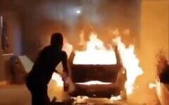 A car is engulfed in flames amid a settler attack on the Palestinian village of Bruqin, in the northern West Bank, on May 23, 2025. (Screenshot: X, used in accordance with Clause 27a of the Copyright Law)
