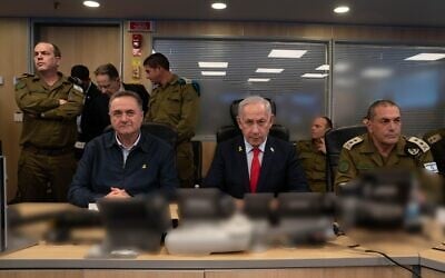Prime Minister Benjamin Netanyahu (center), Defense Minister Israel Katz (left) and IDF Chief of Staff Lt. Gen. Eyal Zamir oversee airstrikes in Yemen, at the Defense Ministry headquarters, Tel Aviv, May 5, 2025. (Ariel Hermoni/ Defense Ministry) Prime Minister Benjamin Netanyahu (center), Defense Minister Israel Katz (left) and IDF Chief of Staff Lt. Gen. Eyal Zamir oversee airstrikes in Yemen, at the Defense Ministry headquarters, Tel Aviv, May 5, 2025. (Ariel Hermoni/ Defense Ministry)