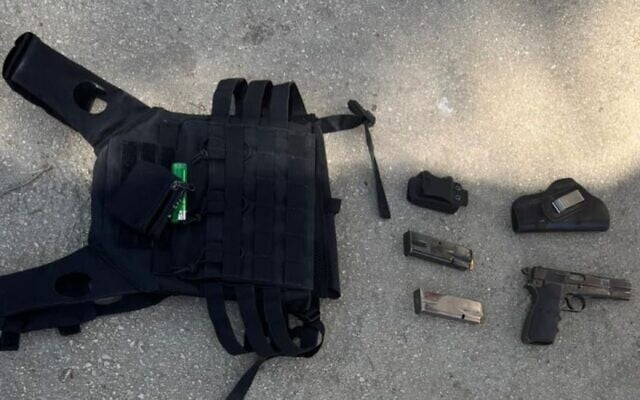 A police handout photo shows a handgun, cash and a tactical vest that were recovered from a Palestinian gunman killed in the northern West Bank city of Nablus on May 8, 2025. (Israel Police)