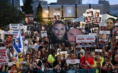 Protesters hold signs with images of the hostages at a weekly anti-government protest at Habima Square in Tel Aviv, May 10, 2025. (Paulina Patimer/Pro-Democracy Protest Movement)