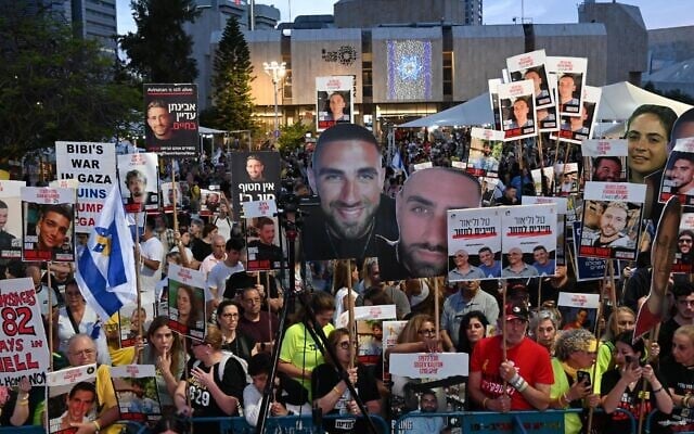 Protesters hold signs with images of the hostages at a weekly anti-government protest at Habima Square in Tel Aviv, May 10, 2025. (Paulina Patimer/Pro-Democracy Protest Movement)