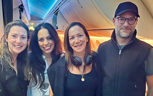 (From R-L) US hostage envoy Adam Boehler, Yael Alexander, Shira Boehler and Boehler's chief of staff Raechel Greenberg on a plane from the US to Israel on May 11, 2025. (Courtesy)