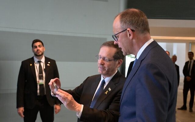 President Isaac Herzog (left) watches the release of hostage Edan Alexander in the Federal Chancellery in Berlin with German Chancellor Friedrich Merz, May 12, 2025. (Amos Ben-Gershom/GPO) President Isaac Herzog (left) watches the release of hostage Edan Alexander in the Federal Chancellery in Berlin with German Chancellor Friedrich Merz, May 12, 2025. (Amos Ben-Gershom/GPO)