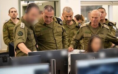 IDF Chief of Staff Lt. Gen. Eyal Zamir (3rd L) and Maj. Gen. (res.) Nitzan Alon, the IDF's point man in the hostage negotiations (2nd R) watch the release of Israeli-US soldier Edan Alexander at the military's hostages and missing persons headquarters on May 12, 2025. (Israel Defense Forces)