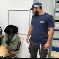 A British activist being questioned by police in a photo released on May 13, 2025. (Police spokesperson)