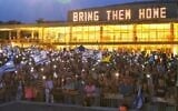 Protesters at Habima Square in Tel Aviv lighting their flashlights as they send a prayer for the safety of hostages in Gaza, May 17, 2025 (Adar Eyal)
