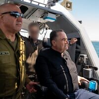 Defense Minister Israel Katz, right, and Navy chief Vice Adm. David Sa'ar Salama are seen on a boat at the Ashdod Naval Base in southern Israel, May 21, 2025. (Ariel Hermoni/Defense Ministry)
