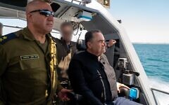 Defense Minister Israel Katz, right, and Navy chief Vice Adm. David Sa'ar Salama are seen on a boat at the Ashdod Naval Base in southern Israel, May 21, 2025. (Ariel Hermoni/Defense Ministry)