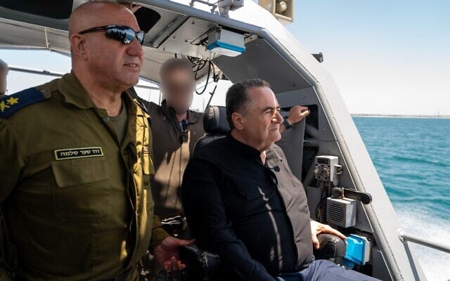 Defense Minister Israel Katz, right, and Navy chief Vice Adm. David Sa'ar Salama are seen on a boat at the Ashdod Naval Base in southern Israel, May 21, 2025. (Ariel Hermoni/Defense Ministry)