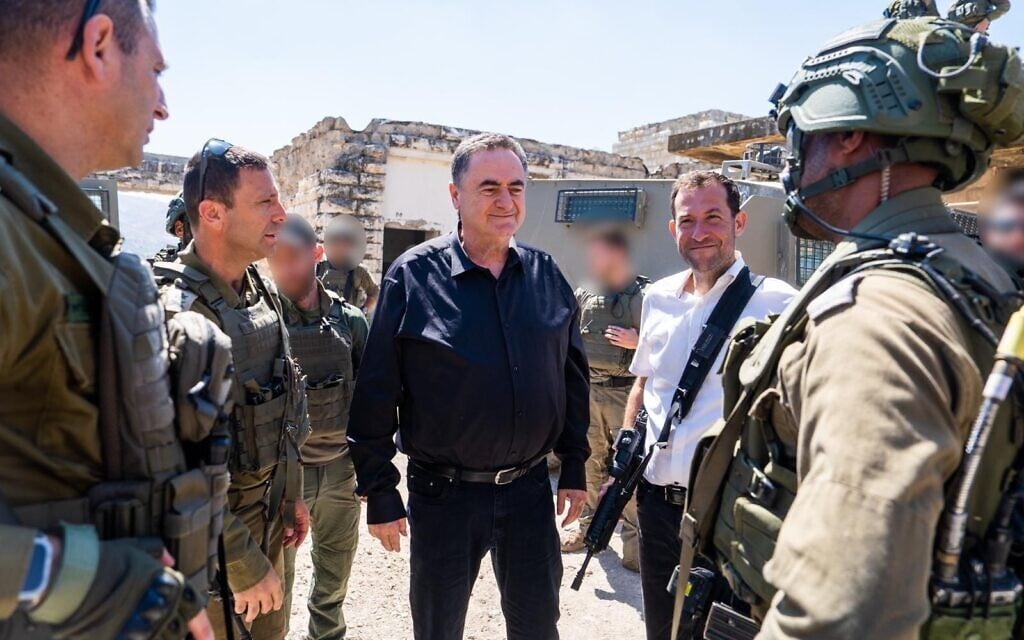 Defense Minister Israel Katz meets with IDF officials at the site of the Sa-Nur settlement in the West Bank after the government approves its reconstruction, May 30, 2025. (Ariel Hermoni/Defense Ministry)