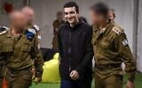 Released hostage soldier Staff Sgt. Edan Alexander, center, arrives at an IDF base near Re'im, May 12, 2025. (Israel Defense Forces)