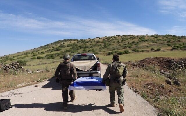 This image released by the IDF on May 11, 2025, shows troops carrying a coffin containing the remains of Sgt. First Class Zvi Feldman, who went missing in 1982. (Israel Defense Forces) This image released by the IDF on May 11, 2025, shows troops carrying a coffin containing the remains of Sgt. First Class Zvi Feldman, who went missing in 1982. (Israel Defense Forces)