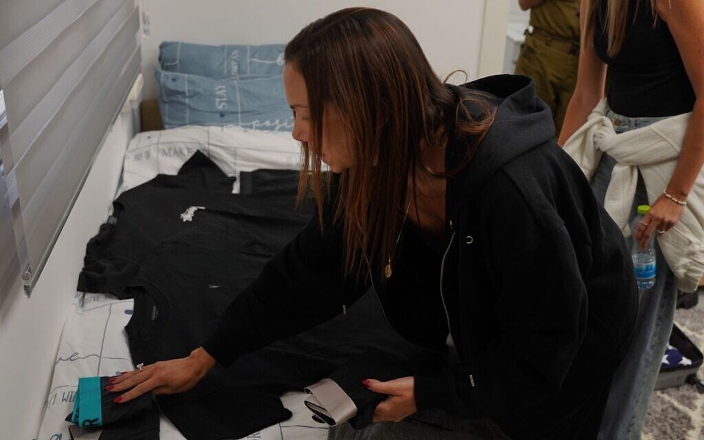 Yael Alexander, mother of freed hostage Edan, prepares his belongings at the military meeting point at Re'im on May 12, 2025 (Israel Defense Forces)