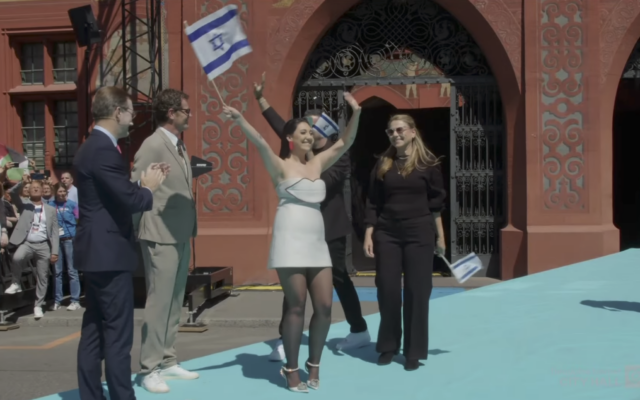 Israel's Eurovision contestant Yuval Raphael walks the 'turquoise carpet' official contest kickoff in Basel, Switzerland, May 11, 2025. (Screenshot/EBU) Israel's Eurovision contestant Yuval Raphael walks the 'turquoise carpet' official contest kickoff in Basel, Switzerland, May 11, 2025. (Screenshot/EBU)