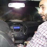 A screenshot of an undated video released by the Israel Defense Forces on December 17, 2023, shows Hamas commander Muhammad Sinwar, right, riding in a car traveling through a tunnel under the Gaza Strip. (Screenshot: Israel Defense Forces)