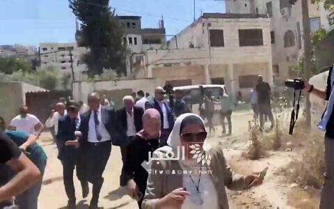 Foreign diplomats run as IDF troops fire warning shots as a group conducts a tour in the West Bank city of Jenin on May 21, 2025 (Screen grab via social media)