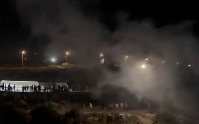 Screen capture from video of a clash between Israeli settlers and Palestinian residents of the West Bank village of Bruqin, May 25, 2025. (X: Used in accordance with Clause 27a of the Copyright Law) Screen capture from video of a clash between Israeli settlers and Palestinian residents of the West Bank village of Bruqin, May 25, 2025. (X: Used in accordance with Clause 27a of the Copyright Law)