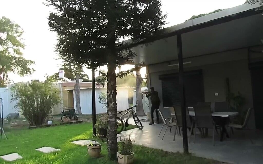 A Hamas terrorist is seen opening fire inside Kibbutz Kerem Shalom on October 7, 2023. (South First Responders) A Hamas terrorist is seen opening fire inside Kibbutz Kerem Shalom on October 7, 2023. (South First Responders)