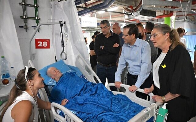 President Isaac Herzog visits Israelis wounded in recent Iranian missile strikes at Sheba hospital's underground treatment facility on June 16, 2025. (Haim Zach / GPO)