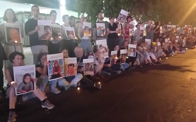 Anti-war activists hold up candles and pictures of slain Gaza children during a silent vigil on Tel Aviv's Kaplan Street, June 7, 2025. (Noam Lehmann/The Times of Israel) Anti-war activists hold up candles and pictures of slain Gaza children during a silent vigil on Tel Aviv's Kaplan Street, June 7, 2025. (Noam Lehmann/The Times of Israel)
