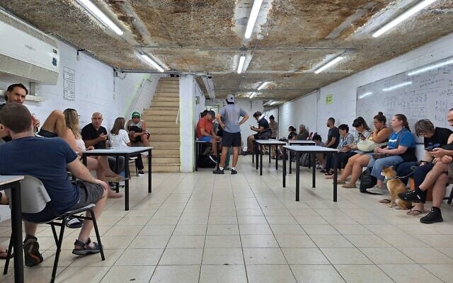 Israelis sit in bomb shelter in Tel Aviv on June 16, 2025 (Times of Israel)