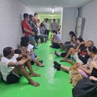 Israelis sit in a bomb shelter in Tel Aviv amid a barrage of rockets from Iran on June 22, 2025 (Times of Israel)