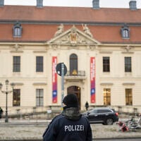 A police officer is pictured in front of the Jewish Museum Berlin building in Berlin, Germany on February 8, 2024. (Stefanie Loos/AFP)