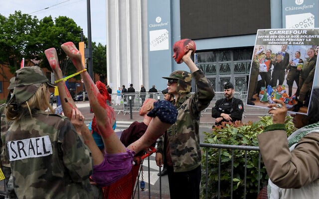 Illustrative: Anti-Israel demonstrators protest outside the Carrefour group's general meeting of shareholders in Aubervilliers, northern Paris, on May 24, 2024. (Mehdi FEDOUACH / AFP)