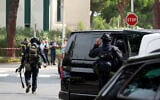 Illustrative: French law enforcement officers stand in front of a synagogue after two cars, one containing a gas bottle, were set alight in the area that morning, causing an explosion that injured a local policeman, La Grande-Motte, south of France, on August 24, 2024. (Pascal GUYOT / AFP)