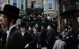 Illustrative: Thousands of Hasidic men converge for the funeral of Rachmastrivka Rebbe in Borough Park, Brooklyn, on August 16, 2023. (Spencer Platt/Getty Images/AFP)