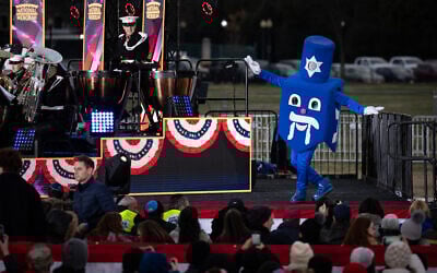 A person dressed as a dreidel performs during the National Menorah Lighting ceremony, on the Ellipse south of the White House December 7, 2023 in Washington, DC (Drew Angerer / GETTY IMAGES NORTH AMERICA / Getty Images via AFP)