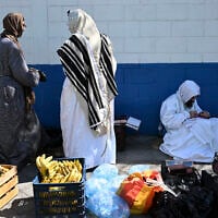 Illustrative: Members of the Lev Tahor Jewish community remain outside the Alida Espana de Arana special education school where where rescued children were being housed in Guatemala City on December 22, 2024. (Johan ORDÓÑEZ / AFP)