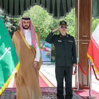 This handout photo made available by the Iranian Army Office on April 17, 2025 shows Iran's Armed Forces Chief of Staff Major-General Mohammed Bagheri (R) receiving Saudi Arabia's Defence Minister Prince Khalid bin Salman in Tehran on April 17, 2025. (Photo by Iranian Army Office / AFP)