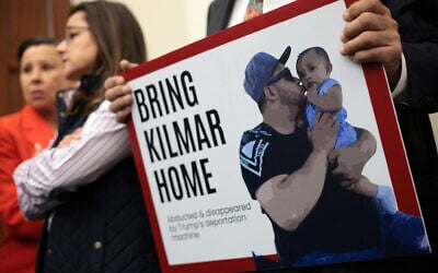 A member of the US Congressional Hispanic Caucus holds a picture of Kilmar Abrego Garcia during a news conference to discuss the Maryland man who was mistakenly deported to El Salvador, at Cannon House Office Building in Washington, April 9, 2025. (Alex Wong/Getty Images/AFP)