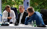 Left to right: France's President Emmanuel Macron, Britain's Prime Minister Keir Starmer and Germany's Chancellor Friedrich Merz take part in a meeting during the European Political Community (EPC) summit, in Tirana, Albania, on May 16, 2025. (Photo by Ludovic MARIN / AFP)