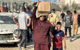 Palestinians receive food packages from the US- and Israel-backed Gaza Humanitarian Foundation in western Rafah in the southern Gaza Strip on May 27, 2025. (AFP)