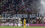 Fans hold a giant banner reading 'Stop genocide in Gaza' during the UEFA Champions League final soccer match between Paris Saint-Germain (PSG) and Inter Milan in Munich, southern Germany, on May 31, 2025. (Odd Andersen / AFP)