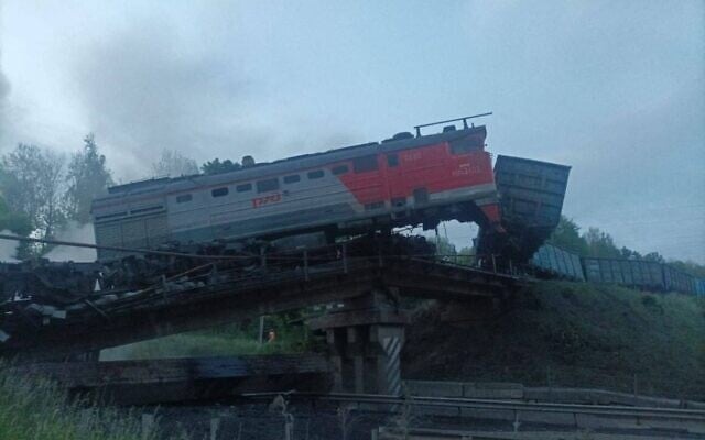 This handout photograph posted on the Telegram account of Kursk region acting governor Alexander Khinshtein on June 1, 2025, shows a train carriage on a rail bridge following its collapse in the Kursk region, Russia. (Handout / Telegram/@Hinshtein / AFP) This handout photograph posted on the Telegram account of Kursk region acting governor Alexander Khinshtein on June 1, 2025, shows a train carriage on a rail bridge following its collapse in the Kursk region, Russia. (Handout / Telegram/@Hinshtein / AFP)