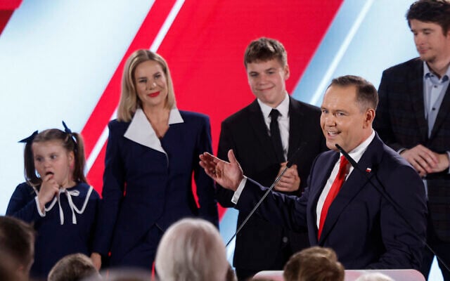 Karol Nawrocki, candidate for the 2025 Polish presidential election supported by Poland's right-wing Law and Justice (PiS) party, addresses supporters as exit polls were announced during their election night event at the Mala Warszawa Theatre in Warsaw, Poland, during the second round of the presidential elections on June 1, 2025.  (Photo by Wojtek RADWANSKI / AFP)