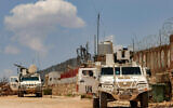 Peacekeepers of the United Nations Interim Force in Lebanon (UNIFIL) ride in armored vehicles during a patrol along the border with Israel by the village of Kfar Kila in south Lebanon on June 4, 2025. (AFP)