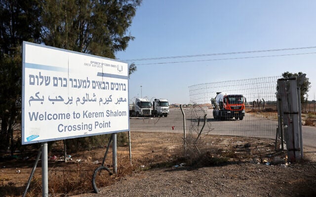 This picture taken from the Israeli side of the border with the Gaza Strip, shows a sign indicating the entrance of the Kerem Shalom crossing between southern Israel and the Gaza Strip on June 5, 2025. (Jack GUEZ / AFP)