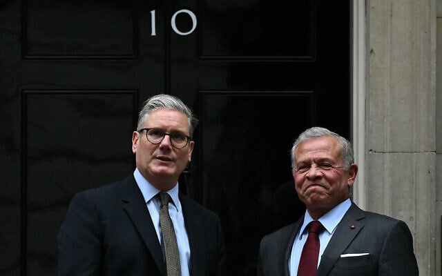 Britain's Prime Minister Keir Starmer (left) greets Jordan's King Abdullah II on the steps of 10 Downing Street in London, on June 5, 2025. (Ben STANSALL / AFP)